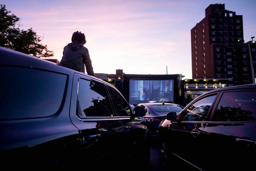  File photo: People in their cars attend a popup drive-in movie night at Bel Air Diner on May 20, 2020 in Queens, New York City.