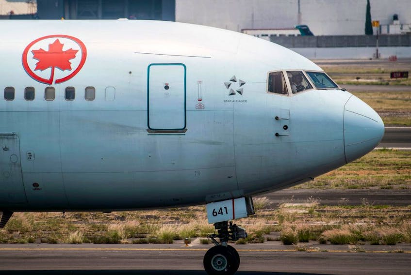 An Air Canada plane prepares to take off at the Benito Juarez International airport, in Mexico City, amid the COVID-19 pandemic, May 20, 2020.