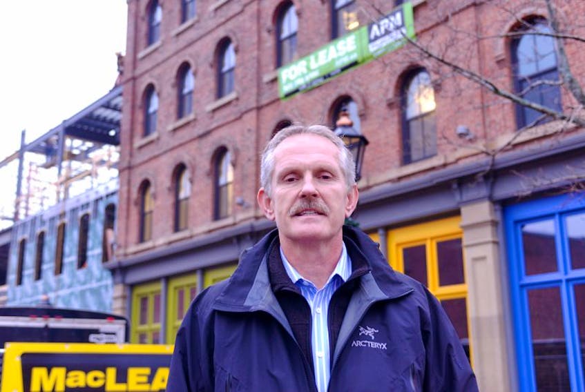 <div id="viewCaption" class="caption">&nbsp;</div>
Alex Forbes, Charlottetown's new manager of planning and heritage, stands beside renovations underway on lower Queen Street at the former Kay's Brothers wholesale shop.