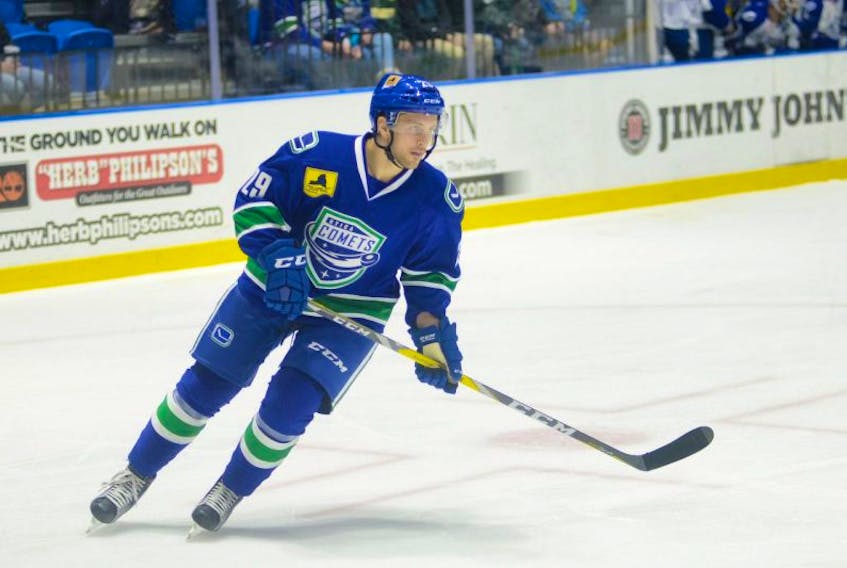 Alex Wall made his American Hockey League debut Wednesday in the Utica Comets' overtime win over the Syracuse Crunch.