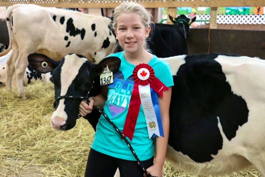 <p>Nine-year-old Alice Duey, with Bovidae Altawiseman Irene, was named the grand champion dairy showman for all of Hants County.</p>