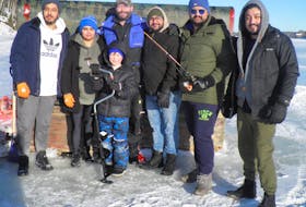 International students from India who attend Cape Breton University and are employees of Church's Valu Foods in Marion Bridge, gathered for a fun-filled day of ice fishing and tobogganing with Jason Church and his family. Shown here are Jay Kalkat, Gurpreet Kaur, Jason and Jake Church, Sahil Grover, Naman Kukreja and Chetan Bhardwaj. CONTRIBUTED