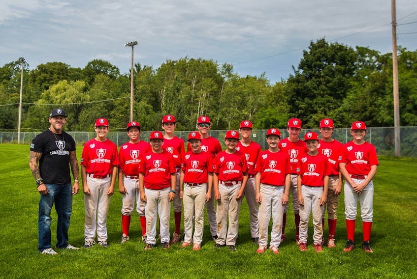 Annapolis Valley native Mark Long, left, creator of the Cracked Armour clothing line, recently donated jerseys and hats to the Peewee AAA Kentville Wildcats baseball team. The young players have been wearing the gear proudly. CONTRIBUTED