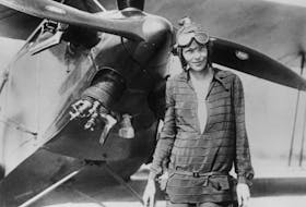 Amelia Earhart stands June 14, 1928 in front of her bi-plane called "Friendship" in Newfoundland. 