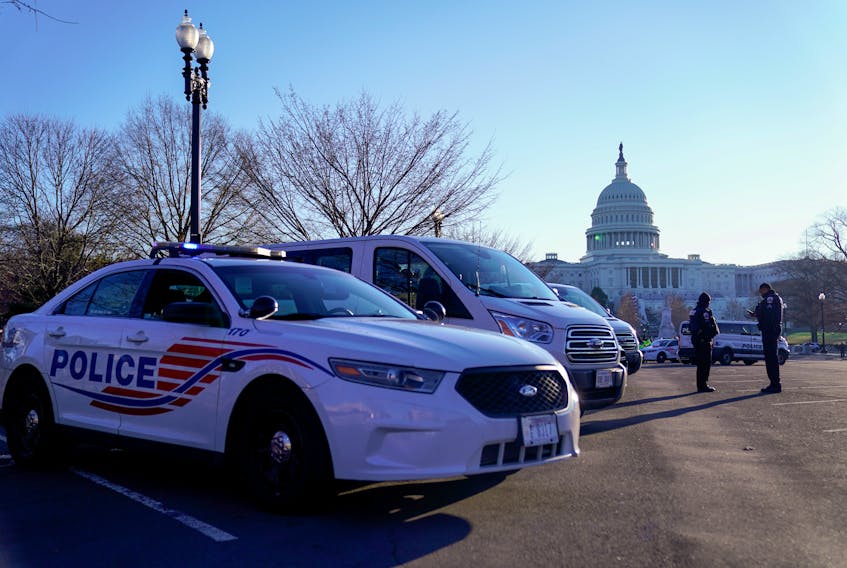 Police vehicles are parked outside the U.S. Capitol Thursday, the day after supporters of U.S. President Donald Trump occupied the building in Washington, D.C. — REUTERS/Erin Scott