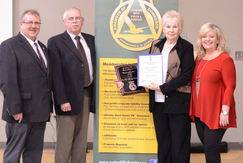 With plaque and certificate in hand, Carolyn Torrie was joined in celebration of Real Tone Hearing Instruments being named Springhill Business of the Year with: (from left) County councillor Doug Williams, Chamber president Harold Delaney, and County councillor Maryanne Williams. 