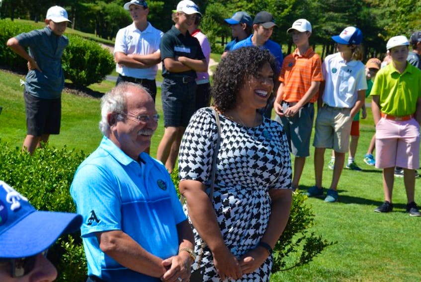 Amherst Mayor David Kogon and Kelsey Jones, daughter of the Dwight Jones, heralded in Dwight Jones Day with a proclamation at the Amherst Golf Club on Aug. 9th.
