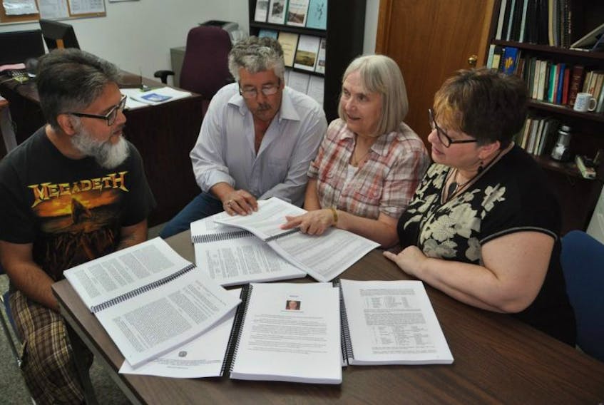 The Cumberland County Genealogical Society has recently published We Rise Again, a five-volume set of information compiled by the late Cyril Oickle on the descendants of Oxford founder Richard Thompson. Board members (from left) Art Brown, John Reid, Barb Reid and Marney Gilroy gathered recently to discuss the research.