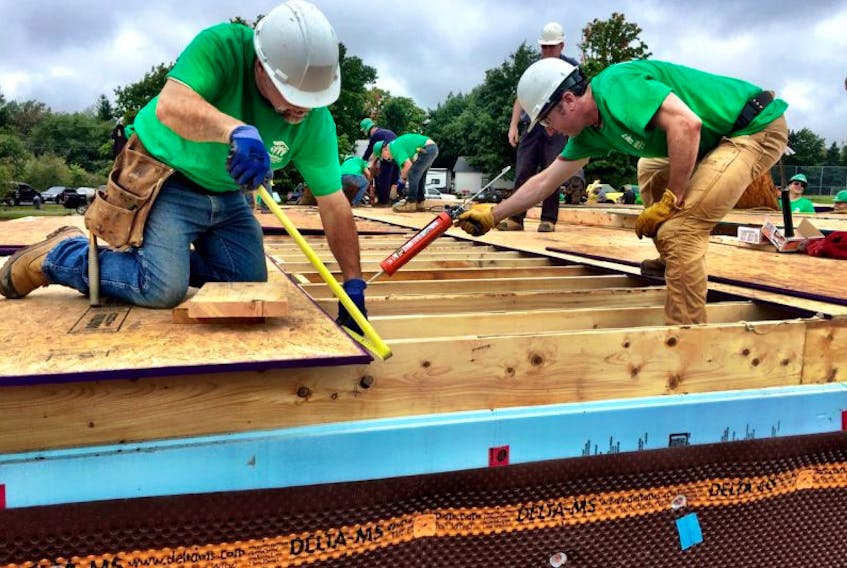Volunteers working on a recent Habitat for Humanity build day in Oxford. The non-profit organization is calling on more volunteers to help with the continued projects there.