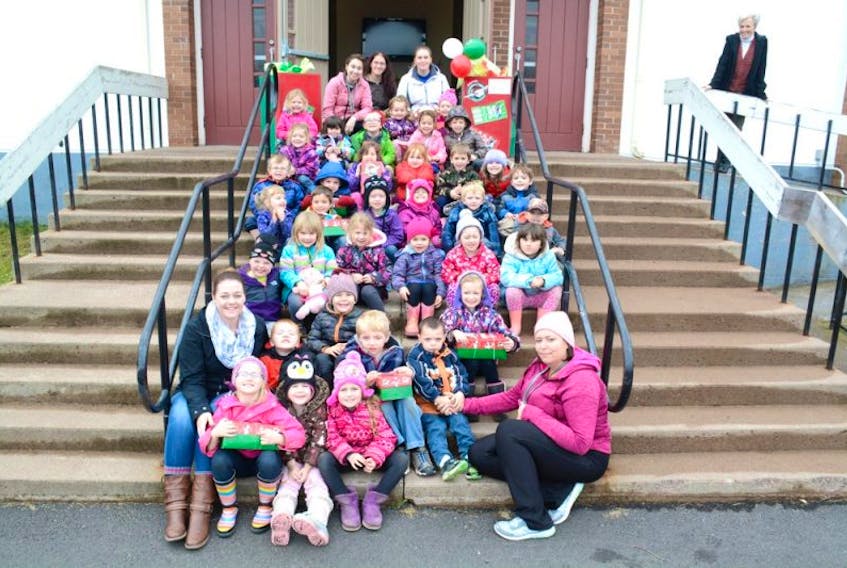Thirty-four kids from the West Highlands Early Years Centre Program packed 10 shoeboxes with gifts and brought them to the Amherst Wesleyan Church on Wednesday. The shoeboxes will be sent to kids throughout the world.