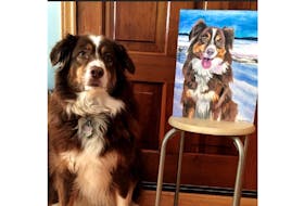 Emilie Chiasson bought her parents a portrait of their dog, Jillie - pictured here beside the portrait - from a local business. Putting thought into selecting a present will help ensure it's a big success with the recipient.