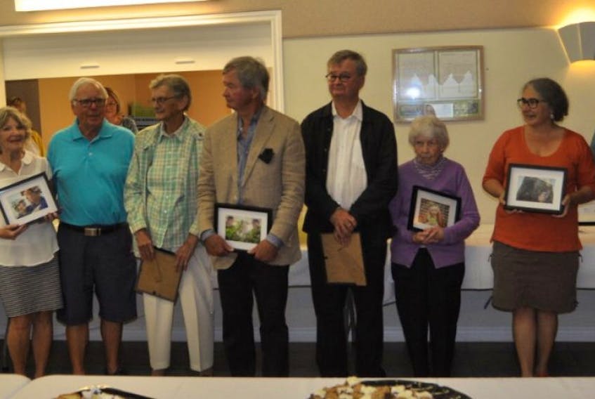 Pugwash Communities in Bloom unveiled its 2018 calendar during a luncheon on Thursday, Sept. 21. Among those participating this year were (from left) Elaine Cook, Paul deVries, Gary Mundle. Joyce Nix, Paul McGlown, Maggie Stone, Stephen Leahy, Douglas Leahy, Betty Brown, Louise Cloutier, Rocky Irons and Thelma Colburne.