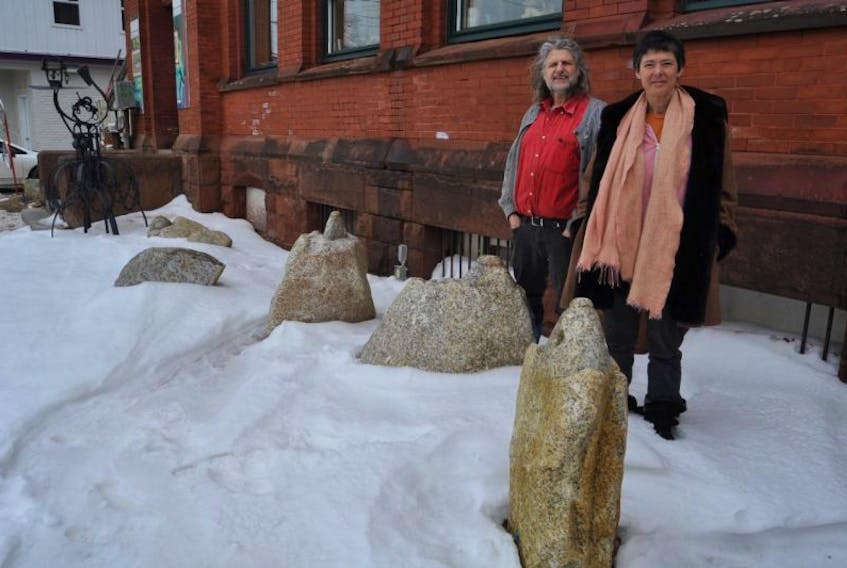 Harvey Lev and Judith Bauer are calling for outdoor sculptures to be installed in and around Parrsboro, and are shown here with the stones that were installed as the very first piece after first issuing the call back in 2013.
