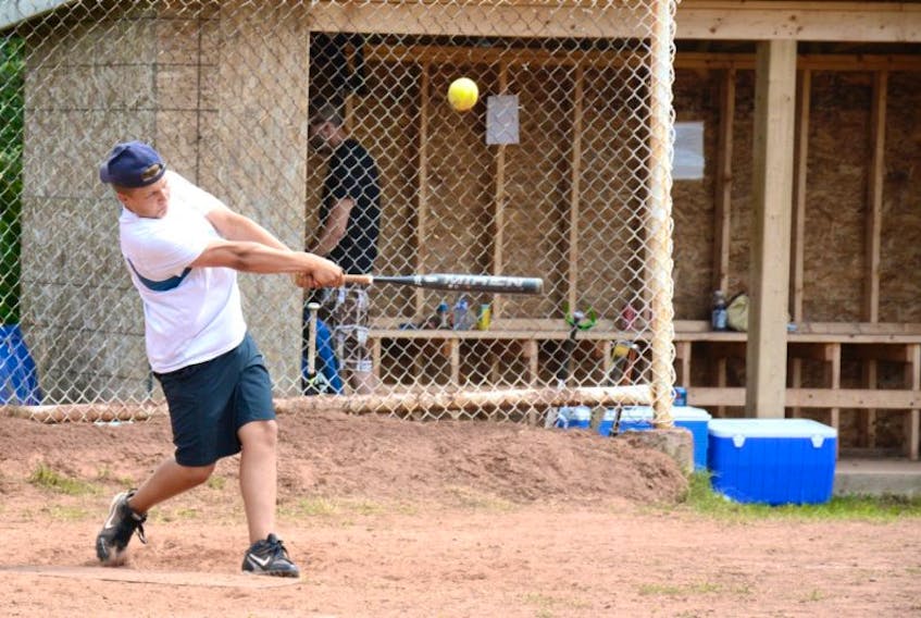 ["Graden Chitty hits a ball during Saturday's action. The Rodney Estabrooks Memorial Softball Tournament has raised more than $120,000 for Muscular Dystrophy, Atlantic Region, in the past 32 years."]