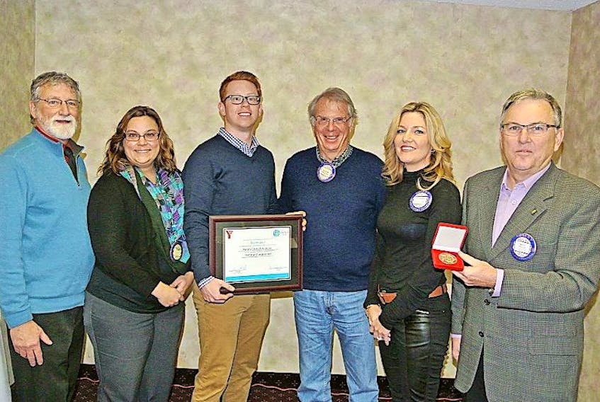Frank Allen, YMCA of Cumberland CEO Trina Clarke and development manager Jeff MacNeil present the 2016 YMCA Peace Medal to Amherst Rotarian Project Committee co-chairs David Christie and Anne Sharpe and club president Ron Wilson.
