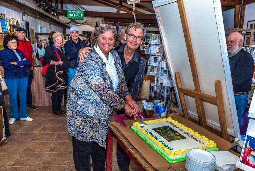 Artist Joy Laking and Parrsboro Creative Robert More cut the cake to open last year's 10 Days in October festival in Parrsboro. This year's event will take place on Oct. 6-15.