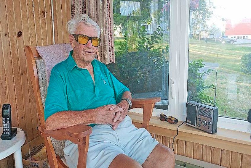 Roger Bacon sits in his rocking chair. The 91-year-old, often referred to as just “Farmer” or “Bacon” farmed for many years, ever since he was a child, on his farm in Nappan.