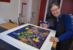 Parrsboro Creative executive director Robert More looks over A Starry Night in Parrsboro, the Joy Laking painting that kicked off the Cumberland County Art Bank program in 2016.