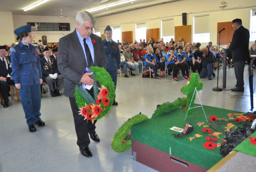 Wreaths and crosses were laid at the Parrsboro legion for Remembrance Day this year, as cold weather prompted organizers to move the activities indoors. Councillor Norman Rafuse laid a wreath on behalf of the Municipality of Cumberland County.