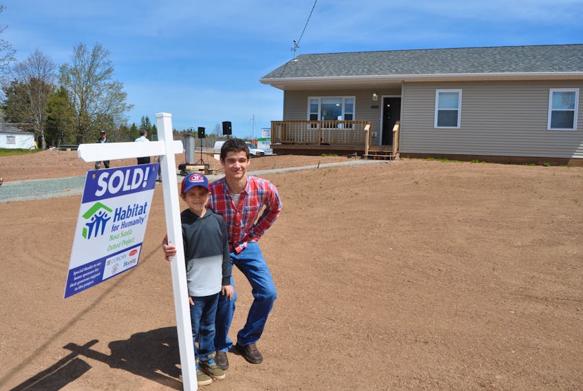 Kale and Caleb Bingley moved into their new home in Oxford day, as the community celebrated the completion of its second Habitat for Humanity home.
