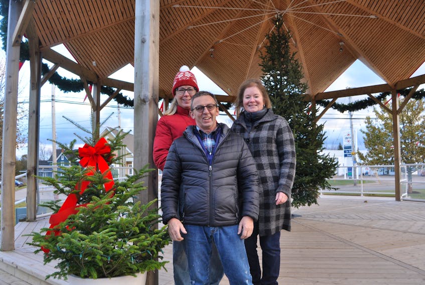 (From left) Donna Yorke, Ron Shaw and Janice McLellan are among the busy volunteers getting Parrsboro ready for its annual Christmas tree light up on Friday, Nov. 24.