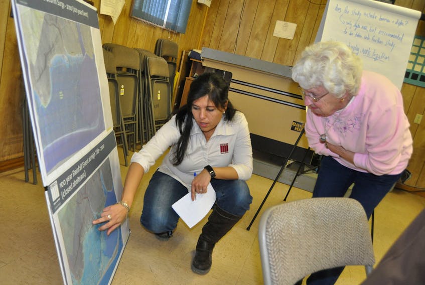 Victoria Fernandez of CBCL answers a question from local resident Hilda Fletcher regarding flood risks in Advocate during a community meeting at the Advocate Fire Hall on Feb. 22.