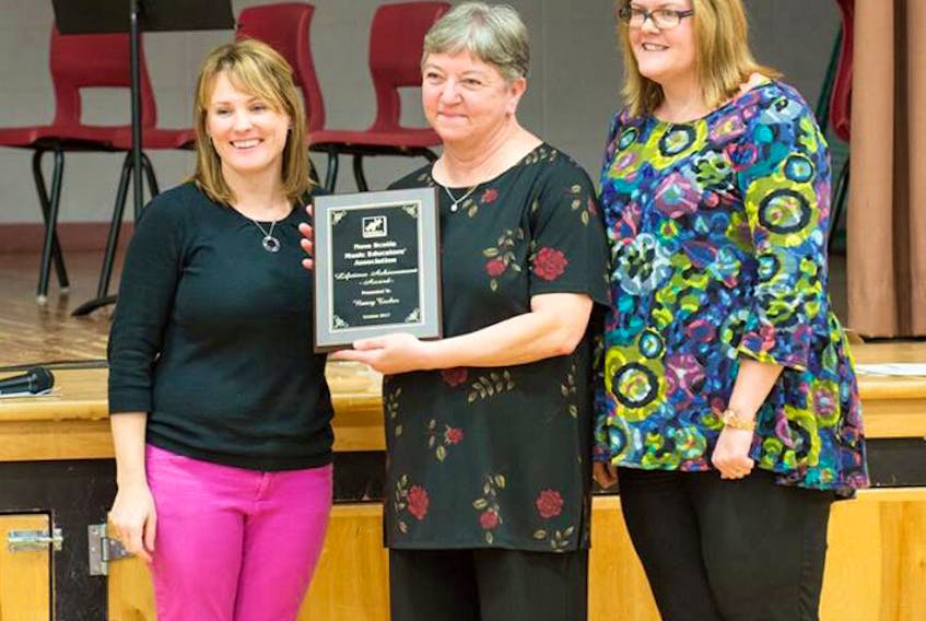 Cumberland North Academy music teacher Nancy Tucker (centre) received the lifetime achievement award from the Nova Scotia Music Educators Association at its last conference day in Cole Harbour. Making the presentation are executive members Keli Brewer and Donalda Westcott.