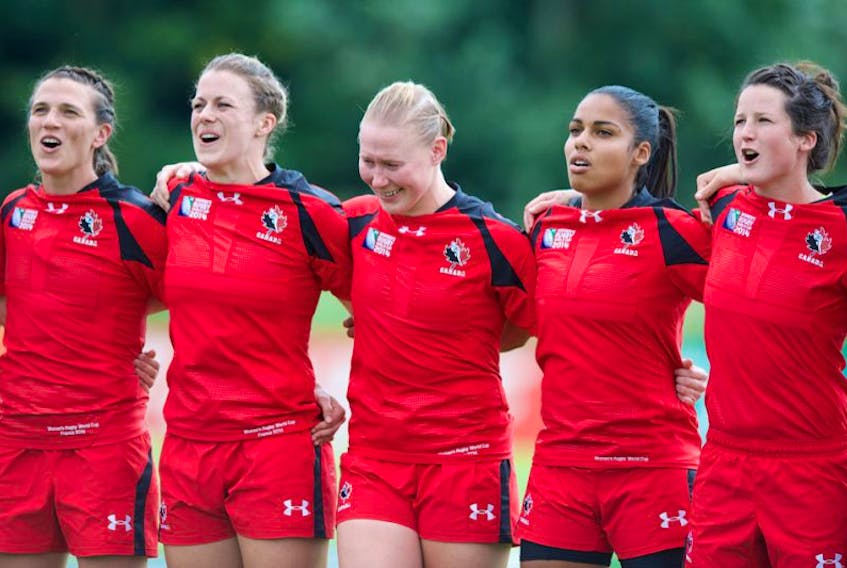 Former Acadia Axewomen Andrea Burk, second from left, is competing with Canada's senior women's rugby team.