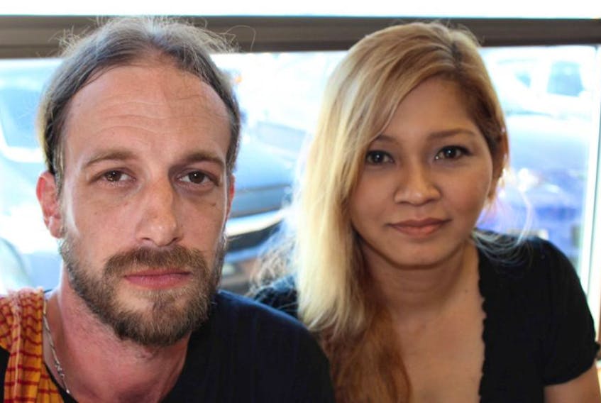 <p>Andrew Day of Paradise and his partner Asliza Md Yusoff, who is originally from Singapore. Yusoff says believes she was grilled by border agents for nearly two and a half hours Tuesday because she is a Muslim.</p>
<p>&nbsp;</p>