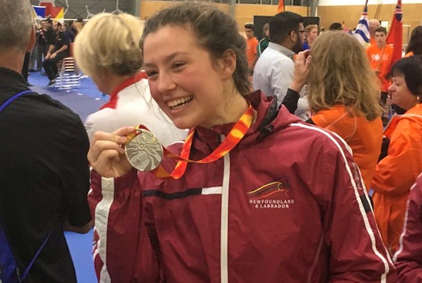 Newfoundland and Labrador's Angel Hiltz-Morell shows off the silver medal she was awarded Friday night at the Canada Games wrestling competition in Winnipeg.