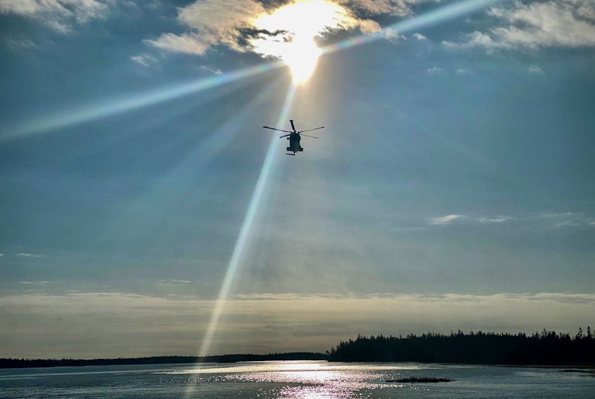 A CH-149 Cormorant Helicopter from 14 Wing Greenwood, searches for a missing person in the skies above the rural communities of Morris Island and Surette's Island, Yarmouth County, on Jan. 13. TINA COMEAU PHOTO