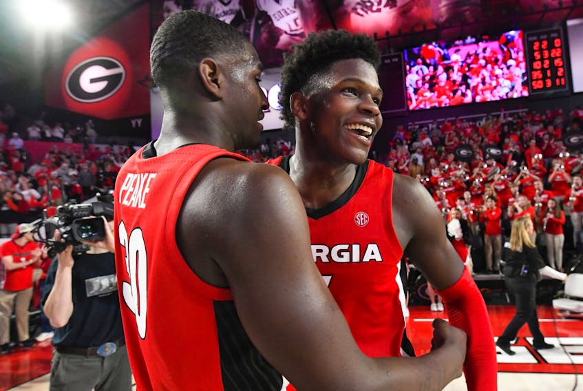 Georgia guard Anthony Edwards (right) was taken by the Minnesota Timberwolves with the No. 1 pick on Wednesday night.