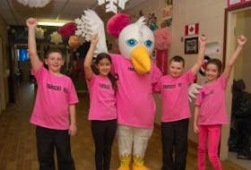 ['Students at Stephenville Elementary School and their mascot Ellie the Eagle pose for a photo as the school participated in anti-bullying activities during the week, including wearing pink shirts on Friday. From left area: Cole Hulan, Jewel Boland, Ellie, Zachary White and Claire McIntosh.<br /><br />']