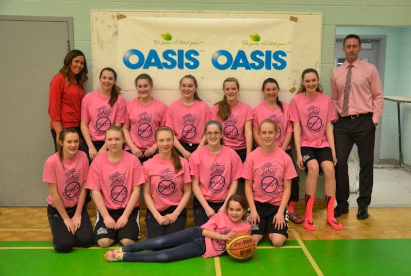 <p class="MsoNormal"><span style="font-family: 'Times New Roman';">The Kentville Bantam Wildcats, along with assistant coach Vanessa Millet, left, and coach Russell Payne, right, show off their pink anti-bullying attire.</span></p>