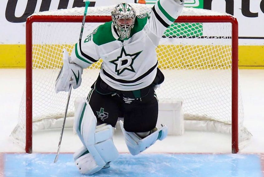 Stars goaltender Anton Khudobin celebrates an overtime series win against the Golden Knights in Game 5 of the Western Conference Final during the 2020 NHL Stanley Cup Playoffs at Rogers Place in Edmonton, Monday, Sept. 14, 2020.