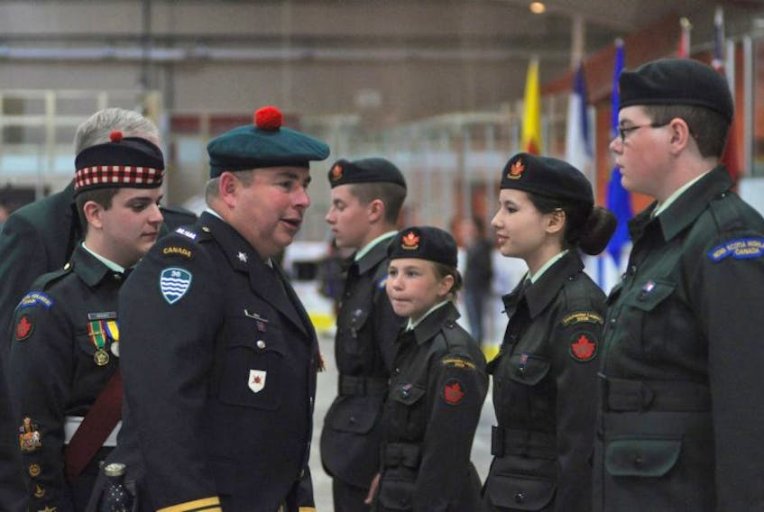 Chief Warrant Officer Ryan Menzies, with the 2928 Royal Canadian Army Cadet Corps, walks along with Lieutenant-Colonel Stephen Gregory Hale during the corps' annual review and inspection held Sunday at the Colchester Legion Stadium. Following the annual review, the cadets hosted demonstrations on biathlon, marksmanship, band and drill.&nbsp;