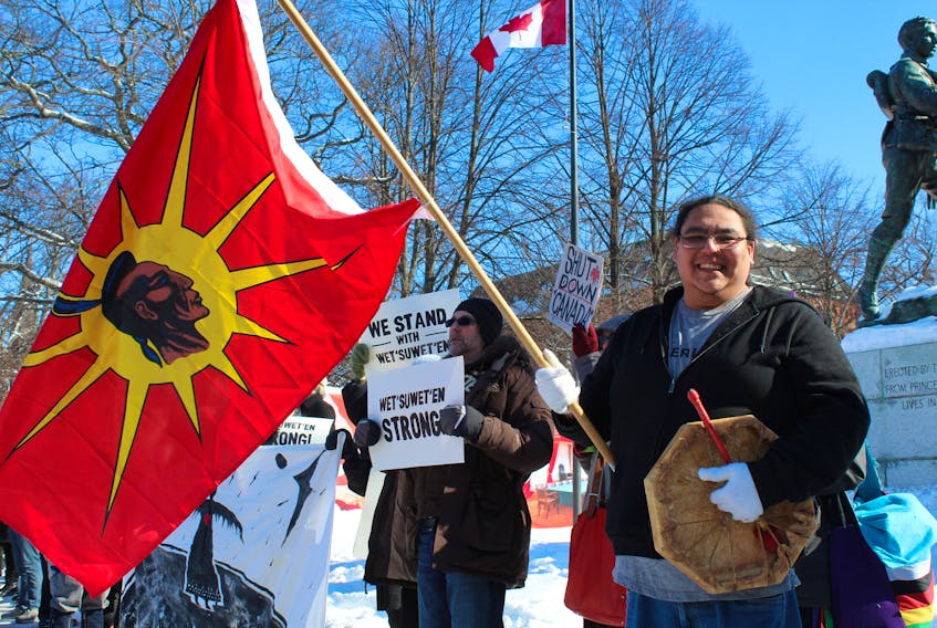 Stephenson Joe, holds his flag and traditional drum at a Wet'suwet'en Solidarity protest in front on Province House on Saturday, Feb. 15. Ernesto Carranza/The Guardian