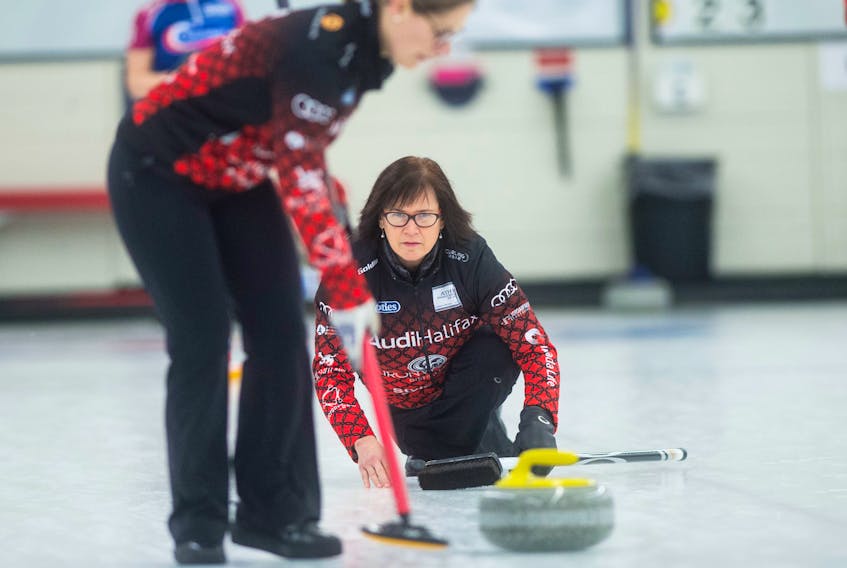 Mary-Anne Arsenault watches her shot as teammate Jen Baxter sweeps during the 2018 Scotties Tournament of Heart. The Arsenault rink is among the contenders for the Nova Scotia Scotties Tournament of Hearts that begins Monday at the Dartmouth Curling Club. Eric Wynne / The Chronicle Herald