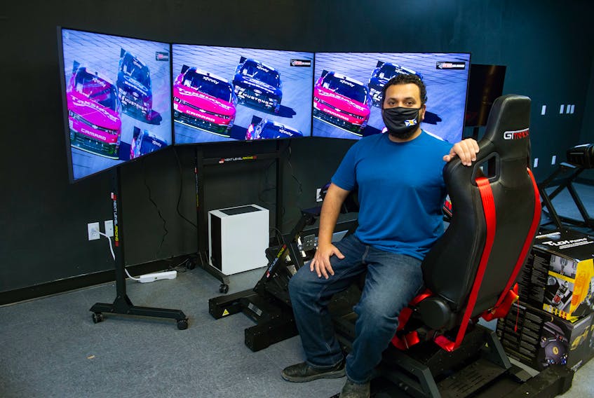 Michael Ramsis, co-owner of Pit Lane Sim Racing in Dartmouth, poses for a photo with one of the simulators at the new business, which will on open on Friday.
Ryan Taplin - The Chronicle Herald