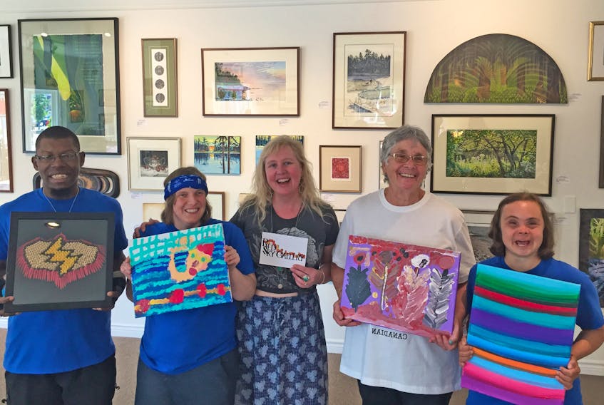 Christian Gerro (left), Elizabeth Abler, Eileen Garvie and Lisa Leuschner recently visited Red Sky Gallery owner Rosemary Curry (centre) to drop off pieces that will be displayed during the upcoming Special Olympics Canada 2018 Summer Games. The L’Arche Antigonish Heart and Hands artistic program members will also compete for Team Nova Scotia in the Games. Corey LeBlanc