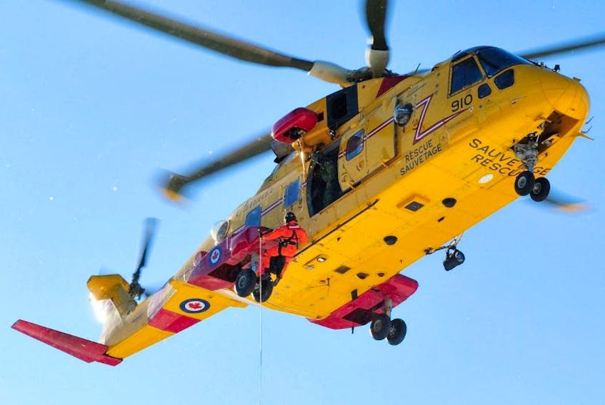 A Search and Rescue Technician is hoisted down from a CH-149 Cormorant helicopter over a confined area in Cloud Lake, NS during a training flight on January 8, 2016. Another exercise is planned in the Annapolis Royal area for Friday, Nov. 4.