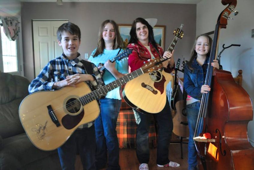 The Country Kids – Garry, Jenney and Ruth Parker – have released two CDs since their first performance on the local Christmas Mommies and Daddies show in November 2013. Their mother, Margery Parker, pictured second from right, occasionally accompanies her children on rhythm guitar.