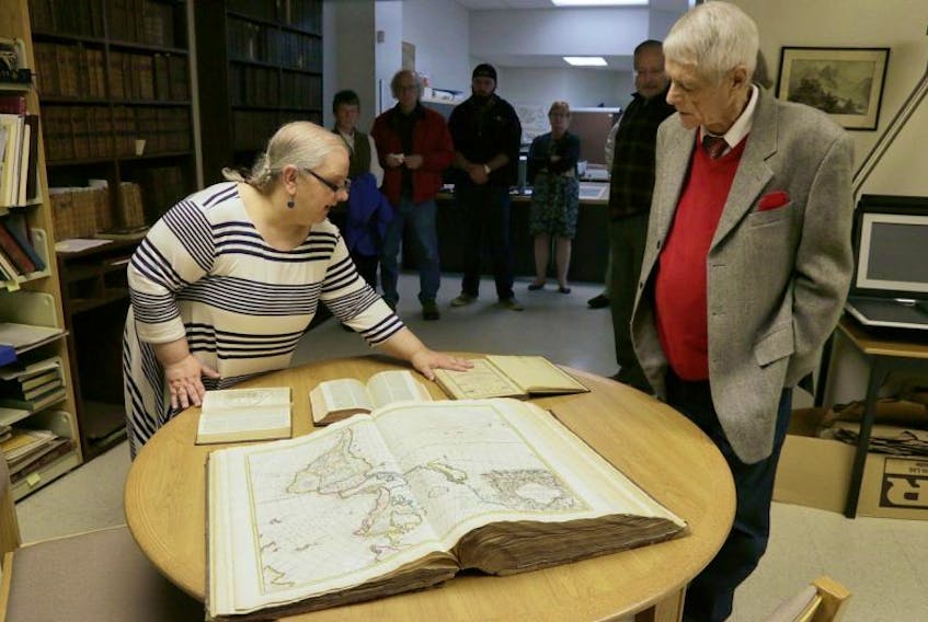 Trish LeBlanc, AVC’s librarian provides a tour to visitors of the WK Morrison map collection at COGS December 2. The W. K. Morrison Special Collection of cartographic books and maps, dating back to the 16th Century, are now available online.
