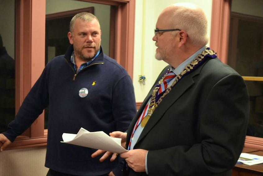 Tim Tanner, left, and Annapolis Royal Mayor Michael Tompkins during a public meeting in December to announce the Annapolis Royal Regional Apartments project that will see the old ARRA school converted into condominiums. The town will keep the wing that houses the gymnasium.