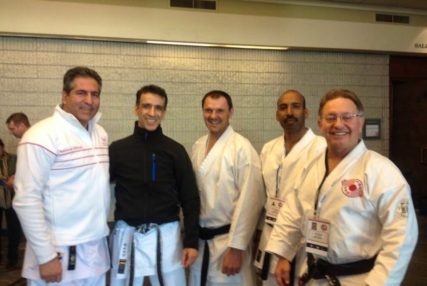 Gary Walsh, right, with other Canadian officials in their Karate Gi's being tested at the Senior Pan Am Karate Championships in Toronto in March. Walsh now has his National Officials License, and his Pan Am Kata Judge C qualifications.