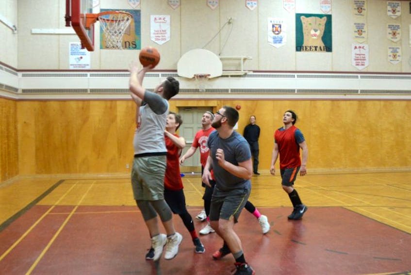 Stephen Wiles scores a layup during 3-on-3 basketball action at the Annapolis Academy March 16.