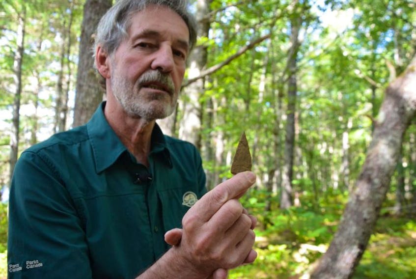 Parks Canada archeologist Charles Burke holds an unfinished arrowhead made from chert, a sedimentary rock that when chipped with another rock has razor sharp edges. Archeologists unearthed thousands of artifacts, mostly stone tools, in a small area at Eel Weir Bridge at Kejimkujik National Park over the summer.