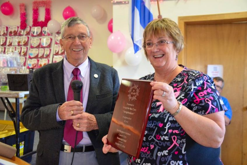 Murray Salsman presented Vicki Smith with a plaque for her outstanding efforts through ‘Scrap for a Cure’ to raise more than 50,000 for the Margaret Salsman Cancer Care Memorial Fund over the past 10 years. The fund assists cancer patients in Kings, Annapolis, and Digby counties with various needs associated with cancer diagnosis and treatment.