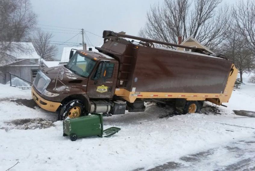This Valley Waste Resource Management truck slipped down a steep street in Cornwallis backwards and landed on a lawn sometime before 9 a.m. on March 22. About eight centimetres of snow fell on Cornwallis on March 21 and by the next morning the streets were a glib of ice.