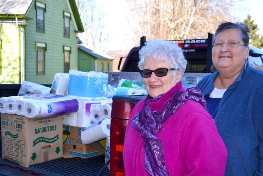 Heather LeFort, right, of the Annapolis Royal Food Bank, and Carol Mason with the Full Gospel Tabernacle Church in LeQuille stand beside one of two trucks loaded with bathroom tissue collected and donated by the church. It’s one item that many people don’t think to donate when they make their contributions at Foodland, Independent Grocer, or Town hall. Mason said the church will now start collecting coffee – another item that is sometimes scarce at food banks.